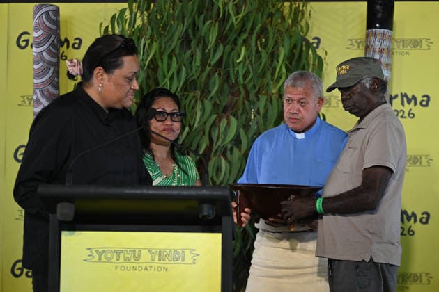 GARMA FESTIVAL, Reverend Alimoni Taumoepeau of Tonga and Australia (2nd right) presents a gift to Djawa YunupiÅ‹u, Chairman, Yothu Yindi Foundation (right) during the 26th annual Garma Festival in Gulkula, Northern Territory, Saturday, August 1, 2026. The Garma Festival takes place on the remote northeast Arnhem Land, celebrating Yolngu culture and customs in a four-day event hosted by the Yothu Yindi Foundation. ( NO ARCHIVING - VISUALS FROM THE YYF GARMA 26TH ANNIVERSARY ARE STRICTLY FOR NEWS AND CURRENT AFFAIRS COVERAGE ONLY. VISUALS MUST NOT BE USED FOR PROMOTIONAL, ADVERTISING, COMMERCIAL, FUNDRAISING OR ANY OTHER PURPOSE Gulkula Ceremonial Site Northern Territory Australia  Copyright: xJamesxRossx 20260802134110712334