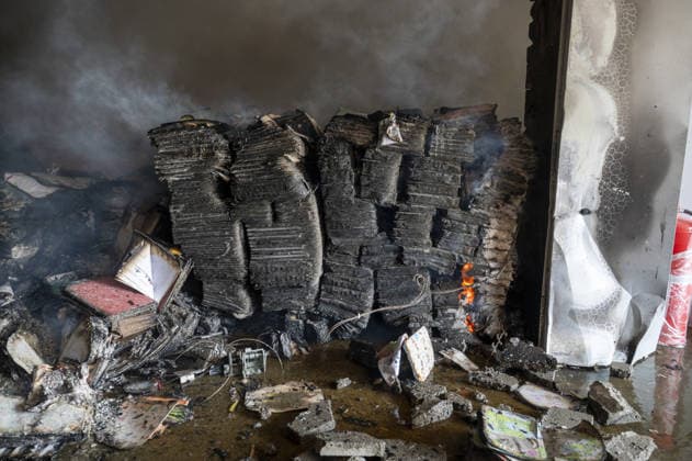 Russian drone strike hits book warehouse in Kharkiv KHARKIV, UKRAINE - AUGUST 1: A view of burned books as firefighters respond to area after two Russian attack drones struck a book warehouse destroying part of the building and sparking a fire that spread across 8,900 square meters in Kharkiv, Ukraine, on August 1, 2026. No casualties were reported, though one firefighter suffered heatstroke while battling the blaze. The warehouse belongs to Ukrainian publisher Ranok and also serves as the distribution center for the KnygoLand bookstore chain. Serhii Masin Anadolu Kharkiv Ukraine. Editorial use only. Please get in touch for any other usage.  Copyright: x2026xAnadoluxSerhiixMasinx