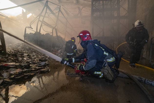 Russian drone strike hits book warehouse in Kharkiv KHARKIV, UKRAINE - AUGUST 1: Firefighters respond to area after two Russian attack drones struck a book warehouse destroying part of the building and sparking a fire that spread across 8,900 square meters in Kharkiv, Ukraine, on August 1, 2026. No casualties were reported, though one firefighter suffered heatstroke while battling the blaze. The warehouse belongs to Ukrainian publisher Ranok and also serves as the distribution center for the KnygoLand bookstore chain. Serhii Masin Anadolu Kharkiv Ukraine. Editorial use only. Please get in touch for any other usage.  Copyright: x2026xAnadoluxSerhiixMasinx