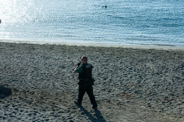 August 2, 2026, Ceuta, Madrid, Spain: A migrant attempts to swim across the border under the watchful eye of the Spanish Civil Guard at El Tarajal beach in Ceuta, Spain, August 2, 2026. Ceuta Spain - ZUMAd308 20260802_zsp_d308_002 Copyright: xJuanxCarlosxLucasx