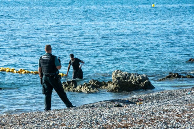 August 2, 2026, Ceuta, Madrid, Spain: A migrant attempts to swim across the border under the watchful eye of the Spanish Civil Guard at El Tarajal beach in Ceuta, Spain, August 2, 2026. Ceuta Spain  - ZUMAd308 20260802_zsp_d308_020 Copyright: xJuanxCarlosxLucasx