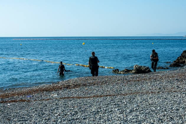 August 2, 2026, Ceuta, Madrid, Spain: A migrant attempts to swim across the border under the watchful eye of the Spanish Civil Guard at El Tarajal beach in Ceuta, Spain, August 2, 2026. Ceuta Spain  - ZUMAd308 20260802_zsp_d308_022 Copyright: xJuanxCarlosxLucasx