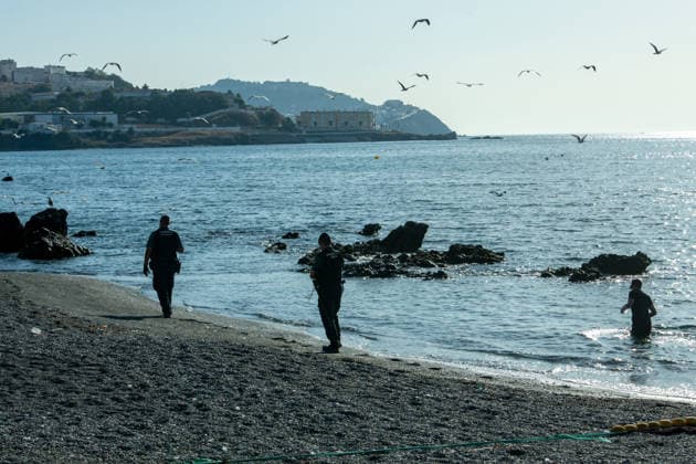 August 2, 2026, Ceuta, Madrid, Spain: A migrant attempts to swim across the border under the watchful eye of the Spanish Civil Guard at El Tarajal beach in Ceuta, Spain, August 2, 2026. Ceuta Spain  - ZUMAd308 20260802_zsp_d308_029 Copyright: xJuanxCarlosxLucasx