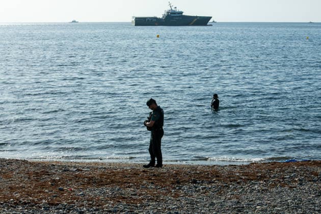 August 2, 2026, Ceuta, Madrid, Spain: A migrant attempts to swim across the border under the watchful eye of the Spanish Civil Guard at El Tarajal beach in Ceuta, Spain, August 2, 2026. Ceuta Spain - ZUMAd308 20260802_zsp_d308_030 Copyright: xJuanxCarlosxLucasx