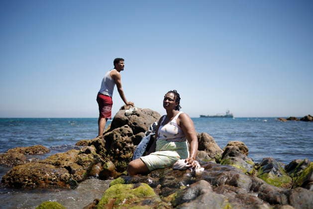 The barriers installed by the government in Ceuta are now fully operational. Two people rest on the beach on August 2, 2026, in Ceuta, Spain. The Tarajal border has remained calm despite a small group of people attempting to swim across, but they were intercepted by the army. Although more than 48,000 migrants who had entered irregularly last Thursday have already left Ceuta, an unknown number of people who have refused to return remain in the city. AUGUST 2, 2026 PIXELATED MIGRATION CRISIS Jesú Ceuta Ceuta, Spain  Copyright: xJesusxTorresx 7699309