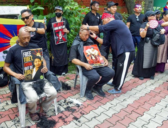 Tibetan people stage a protest march against China s Ethnic Unity and Progress Law Dehradun, Aug 02 (ANI): Tibetan community men shave their heads to express opposition to China s Ethnic Unity and Progress Law during a protest, in Dehradun on Sunday. Dehradun Uttarakhand India Copyright: xANIx ANI_20260802306