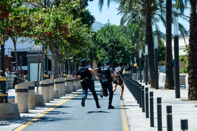 August 2, 2026, Ceuta, Madrid, Spain: Military personnel and police officers escort a group of Moroccan migrants toward the border with Morocco in the Spanish enclave of Ceuta, Spain, August 2, 2026. Armed forces and national police have begun rounding up and escorting the remaining migrants who entered irregularly during a massive migration crisis in recent days, allowing the city s streets and shops to return to normalcy. Ceuta Spain - ZUMAd308 20260802_zsp_d308_101 Copyright: xJuanxCarlosxLucasx