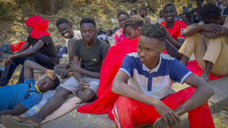 Migrant crisis in Cueta An unprecedented border crisis has hit the Spanish North African enclave of Ceuta, where an estimated 60,000 migrants crossed from Morocco. Pictured. African migrants resting on the street. 02.08.2026  Copyright: xIanxWhittakerx NINTCHDBPICT001099189110