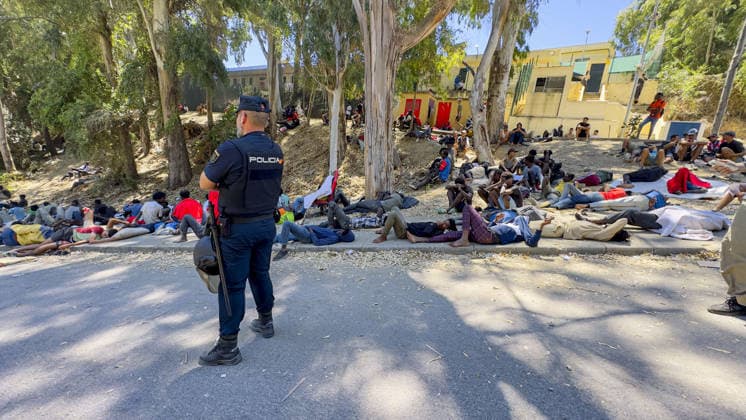Migrant crisis in Cueta An unprecedented border crisis has hit the Spanish North African enclave of Ceuta, where an estimated 60,000 migrants crossed from Morocco. Pictured. African migrants resting on the street. 02.08.2026  Copyright: xIanxWhittakerx NINTCHDBPICT001099189216