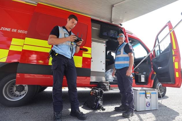 Firefighters pictured at the scene of a brush fire along the E25 highway in Bastogne, on Monday 03 August 2026. A major brush fire broke out Monday morning in the municipality of Bastogne, near the Withimont highway rest area.  JULIENxWARNAND 182681976