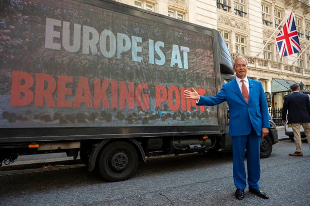 August 3, 2026, London, London, UK: LONDON, UK. Nigel Farage, Leader of Reform UK, next to a promotional van after giving a press conference in Westminster unveiling Ã¢â‚¬ËœOperation Fortress - Stopping the Invasion of BritainÃ¢â‚¬â ¢, the partyÃ¢â‚¬â ¢s plan to stop illegal migrants crossing English Channel in small boats by using the Royal Navy and Royal Marines. London UK  - ZUMAl94_ 20260803_zaf_l94_071 Copyright: xStephenxChungx