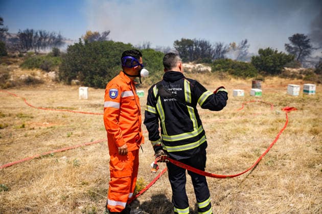 Wildfire in Greece s Megara region MEGARA, GREECE - AUGUST 3: Firefighters operate on the ground as a wildfire continues to burn for a third consecutive day in the Megara region, west of Athens, Greece on August 3, 2026. Emergency services are working to contain the blaze amid challenging weather conditions across the area. Aris Oikonomou Anadolu Megara Greece. Editorial use only. Please get in touch for any other usage.  Copyright: x2026xAnadoluxArisxOikonomoux
