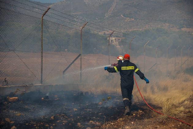 Wildfire in Greece s Megara region MEGARA, GREECE - AUGUST 3: Firefighters operate on the ground as a wildfire continues to burn for a third consecutive day in the Megara region, west of Athens, Greece on August 3, 2026. Emergency services are working to contain the blaze amid challenging weather conditions across the area. Aris Oikonomou Anadolu Megara Greece. Editorial use only. Please get in touch for any other usage.  Copyright: x2026xAnadoluxArisxOikonomoux