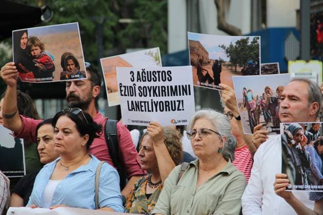 August 3, 2026, Izmir, ToÂ¼rkiye: ZMÄÂ°R, ToÂ¼rkiye Ã¢â‚¬ August 3, 2026: Members of the DEM Party WomenÃ¢â‚¬â ¢s Assembly and the Free WomenÃ¢â‚¬â ¢s Movement (Tevgera JinoÂªn Azad) hold a press statement in Alsancak to mark the 12th anniversary of the ISIS attack on the Yazidi community in Sinjar, Iraq. Participants display photographs of Yazidi women who were killed, abducted, or subjected to sexual slavery during the 2014 attacks, commemorating victims of atrocities recognized by the United Nations and the European Parliament as genocide. Izmir Türkiye - ZUMAq101 20260803_zna_q101_021 Copyright: xNagihanxCakirx