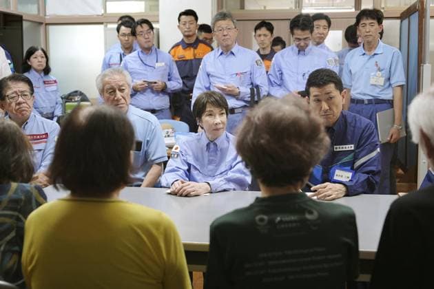 Japan PM Takaichi visits quake-hit Kumamoto Japanese Prime Minister Sanae Takaichi (C) meets with people at an evacuation center in Hikawa in Kumamoto Prefecture on Aug. 3, 2026, after a powerful earthquake struck the southwestern Japan prefecture and its vicinity on July 28. (Pool photo)  A14AA0005625014P