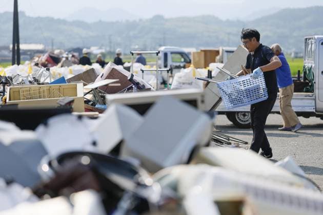 Aftermath of strong earthquake in Kumamoto Disaster waste is brought to a temporary storage site in Hikawa, Kumamoto Prefecture, on Aug. 4, 2026, following a powerful earthquake that struck the southwestern Japan prefecture on July 28.  A14AA0005625032P