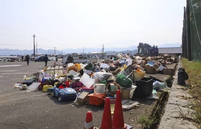 Aftermath of strong earthquake in Kumamoto Disaster waste is pictured at a temporary storage site in Hikawa, Kumamoto Prefecture, on Aug. 4, 2026, following a powerful earthquake that struck the southwestern Japan prefecture on July 28.  A14AA0005625034P