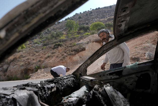 Israeli settlers set fire to three cars and damaged a power line in Nablus NABLUS, WEST BANK, PALESTINE - AUGUST 04: Palestinians inspect burnt-out cars following a raid by Israeli settlers who attacked homes, set three cars on fire, and damaged power lines between the villages of Jalud and Telfit near Nablus in West Bank, Palestine on August 04, 2026. Issam Rimawi Anadolu Nablus West Bank. Editorial use only. Please get in touch for any other usage.  Copyright: x2026xAnadoluxIssamxRimawix