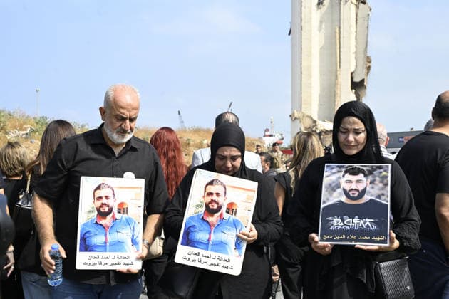 Memorial ceremony held in Lebanon to mark sixth anniversary of Beirut Port explosion BEIRUT, LEBANON - AUGUST 4: People attend a memorial ceremony held in front of the monument bearing the names of those killed in the Aug. 4, 2020 Beirut Port explosion, marking the sixth anniversary of the disaster while holding photos, in Beirut, Lebanon, on August 4, 2026. The ceremony was attended by families of the victims, Lebanese Justice Minister Adel Nassar, Information Minister Paul Markus, Social Affairs Minister Haneen El Sayed, ambassadors of several countries that lost citizens in the explosion, and other members of the diplomatic corps. Houssam Shbaro Anadolu Beirut Lebanon. Editorial use only. Please get in touch for any other usage.  Copyright: x2026xAnadoluxHoussamxShbarox
