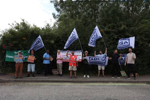August 4, 2026, London, England, United Kingdom: Members of the App Drivers & Couriers Union (ADCU), Brent Green Party and the Pull the Plug on Waymo campaign attend a protest outside WAYMO s offices in Park Royal, London, opposing the expansion of autonomous vehicles. Demonstrators argued that driverless technology threatens drivers job security and livelihoods and called for greater protections for workers rights. London United Kingdom  - ZUMAa279 20260804_zsp_a279_005 Copyright: xZeynepxDemirxAslimx