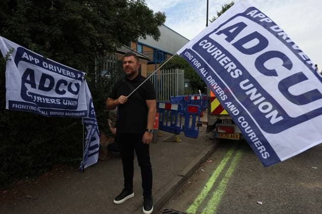 August 4, 2026, London, England, United Kingdom: Members of the App Drivers & Couriers Union (ADCU), Brent Green Party and the Pull the Plug on Waymo campaign attend a protest outside WAYMO s offices in Park Royal, London, opposing the expansion of autonomous vehicles. Demonstrators argued that driverless technology threatens drivers job security and livelihoods and called for greater protections for workers rights. London United Kingdom  - ZUMAa279 20260804_zsp_a279_009 Copyright: xZeynepxDemirxAslimx
