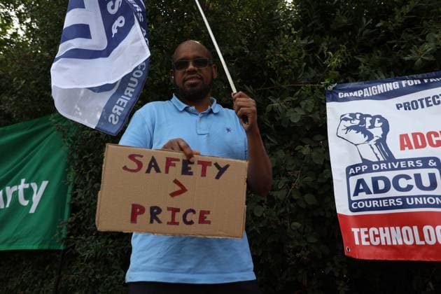 August 4, 2026, London, England, United Kingdom: Members of the App Drivers & Couriers Union (ADCU), Brent Green Party and the Pull the Plug on Waymo campaign attend a protest outside WAYMO s offices in Park Royal, London, opposing the expansion of autonomous vehicles. Demonstrators argued that driverless technology threatens drivers job security and livelihoods and called for greater protections for workers rights. London United Kingdom - ZUMAa279 20260804_zsp_a279_002 Copyright: xZeynepxDemirxAslimx