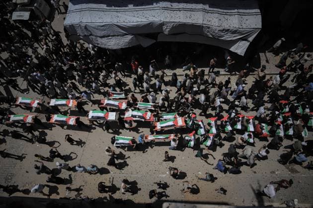 Palestinians Hold Mass Funeral for 112 Members of Two Families in Gaza GAZA CITY, PALESTINE August 4, 2026: Palestinians carry the remains of 112 members of the Al-Hassaina and Abu Sharia families during a mass funeral procession in the Al-Sabra neighborhood of Gaza City on August 4, 2026. The victims were killed in separate Israeli attacks during the war that began on October 7, 2023, and their bodies were recovered from beneath the rubble months later. According to local authorities, the procession was among the largest funeral processions held in the Gaza Strip since the beginning of the war. Gaza Palestine, State of Copyright: x xMohammedxMxSkaikx xJNAxPressx