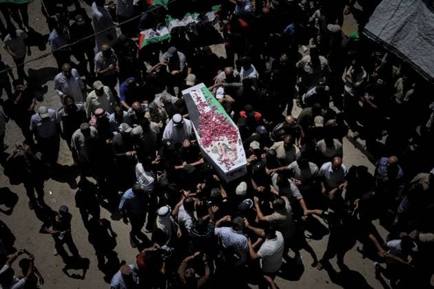 Palestinians Hold Mass Funeral for 112 Members of Two Families in Gaza GAZA CITY, PALESTINE August 4, 2026: Palestinians carry the remains of 112 members of the Al-Hassaina and Abu Sharia families during a mass funeral procession in the Al-Sabra neighborhood of Gaza City on August 4, 2026. The victims were killed in separate Israeli attacks during the war that began on October 7, 2023, and their bodies were recovered from beneath the rubble months later. According to local authorities, the procession was among the largest funeral processions held in the Gaza Strip since the beginning of the war. Gaza Palestine, State of Copyright: x xMohammedxMxSkaikx xJNAxPressx