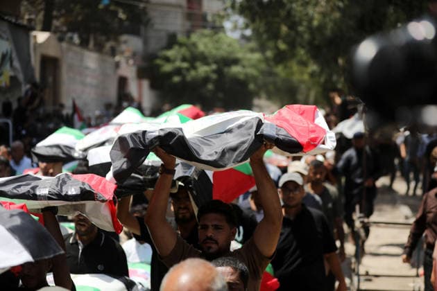 Mass funeral held for recovered remains in Gaza City s Sabra neighborhood Palestinians take part in a mass funeral for the recovered remains of members of the Abu Sharia and Al-Hasayna families in the Sabra neighborhood of Gaza City on August 4, 2026. The remains were recently recovered from beneath the rubble of their homes, which were destroyed in an Israeli strike earlier in the war. Gaza s Civil Defense said its crews recovered the remains of 112 people during a two-week operation in the residential area where the two families lived, which it said was hit in an Israeli airstrike on November 23, 2023. The Civil Defense estimates that more than 9,000 people remain missing or buried beneath the rubble of destroyed buildings across the Gaza Copyright: xapaimagesxBilalxOsamax xapaimagesx