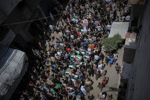 August 4, 2026, Gaza, Palestine, State of: GAZA Gaza, PALESTINE Ã¢â‚¬ August 4, 2026: Palestinians carry the remains of 112 members of the Al-Hassaina and Abu Sharia families during a mass funeral procession in the Al-Sabra neighborhood of Gaza City on August 4, 2026. The victims were killed in separate Israeli attacks during the war that began on October 7, 2023, and their bodies were recovered from beneath the rubble months later. According to local authorities, the procession was among the largest funeral processions held in the Gaza Strip since the beginning of the war. Gaza Palestine, State of  - ZUMAq101 20260804_zna_q101_011 Copyright: xMohammedxMxSkaikx