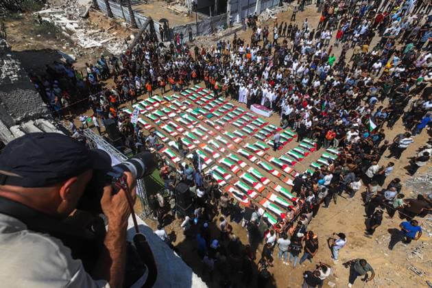 August 4, 2026, Gaza, Palestine, State of: GAZA Gaza, PALESTINIAN TERRITORIES Ã¢â‚¬ AUGUST 4, 2026: Palestinians attend the funeral of 112 members of the Hassayna and Abu Sharia families, who were killed in an Israeli strike in 2023 and whose remains were recently recovered from beneath the rubble, according to Gaza s Civil Defense, in Gaza City on August 4, 2026. Gaza Palestine, State of  - ZUMAq101 20260804_zna_q101_023 Copyright: xRamezxHabboubx