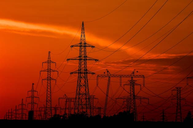 (260803) -- BUDAPEST, Aug. 3, 2026 -- Power transmission facilities are seen from the banks of the Danube River near Dunaszentbenedek, Hungary, Aug. 2, 2026. Hungary is entering its most critical 5 days as dropping water levels on the Danube River threaten the complete shutdown of the Paks nuclear power plant amid an extreme heatwave, Hungary s Prime Minister Peter Magyar said on Sunday, warning that the plant could be shut down for more than a month. (Photo by Xinhua) HUNGARY-NUCLEAR POWER PLANT-POSSIBLE SHUTDOWN DavidxBalogh 