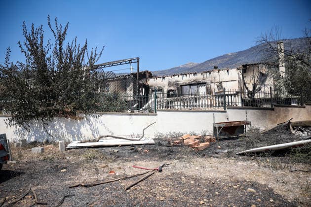 Wildfire continues for fourth day in Psatha, Greece PSATHA, GREECE - AUGUST 04: Burned houses and olive trees are seen in the aftermath of a wildfire in Psatha, Greece, on August 04, 2026. Thousands of square meters of forest, along with several houses, have been destroyed. Although the fire fronts have calmed after four days of intense burning, authorities remain on alert. Aris Oikonomou Anadolu Psatha Greece. Editorial use only. Please get in touch for any other usage.  Copyright: x2026xAnadoluxArisxOikonomoux