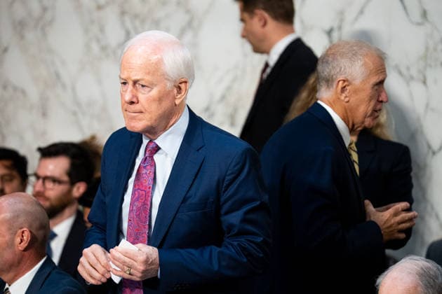Sen. John Cornyn and Sen. Thom Tillis UNITED STATES - AUGUST 4: Sen. John Cornyn, R-Texas, left, and Sen. Thom Tillis, R-N.C., right, speak to staff after the Senate Judiciary Committee voted to move the nomination of Acting Attorney General Todd Blanche out of committee in the Hart Senate Office Building on Tuesday, Aug 4, 2026. (Bill Clark CQ Roll Call) Washington DC United States EDITORIAL USE ONLY Copyright: x 2026xCQxRollxCallx BillxClarkx rollcallpix172353