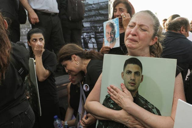 August 4, 2026, Beirut, Beirut, Lebanon: Rola Malahi, mother of Lebanese fire fighter Ralph Malahi, who was killed in the Beirut 2020 Beirut port blast, weeps as she hugs the picture of her son during a ceremony to mark the six anniversary of the massive explosion that killed more than 200 people and injuring more than 6,500 others. Lebanese authorities have said the explosion was triggered by a fire in a warehouse where tones of ammonium nitrate fertilizer had been stored haphazardly for years, despite repeated warnings to senior officials. Beirut Lebanon - ZUMAn313 20260804_zip_n313_003 Copyright: xMarwanxNaamanix