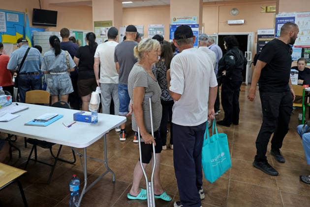 People evacuated from communities in the Kharkiv region receive assistance at an evacuation hub in Kharkiv, Ukraine, August 4, 2026. Evacuation efforts have been intensified in the Kharkiv region, mainly in the Shevchenkove and Staryi Saltiv settlement communities, due to constant Russian bombardment of civilians. (Photo by Viacheslav Madiievskyi Ukrinform) Evacuation hub in Kharkiv  Copyright: xViacheslavxMadiievskyix