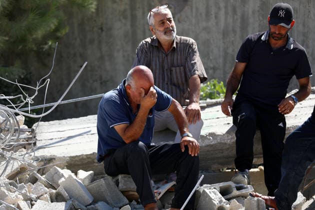 Israeli forces demolish two Palestinian homes in Nahhalin BETHLEHEM, WEST BANK, PALESTINE - AUGUST 5: Residents are seen as Israeli forces, accompanied by bulldozers, demolish two Palestinian homes and a commercial property after raiding the town of Nahhalin, west of Bethlehem, West Bank, Palestine, on August 5, 2026. Wisam Hashlamoun Anadolu Bethlehem West Bank. Editorial use only. Please get in touch for any other usage.  Copyright: x2026xAnadoluxWisamxHashlamounx