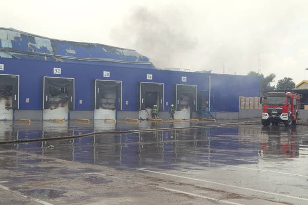 A fire engine of the State Emergency Service is outside a logistics centre of the home improvement company destroyed by an overnight Russian strike in Kyiv, Ukraine, August 5, 2026. The facility on the Left Bank of the Ukrainian capital served as one of the key distribution hubs and an order collection centre for the hypermarket chain. (Photo by Kyrylo Chubotin Ukrinform) Logistics centre of home improvement company destroyed by Russian attack on Kyiv  Copyright: xKirillxChubotinx