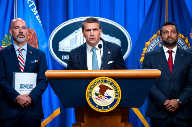Drug Enforcement Administration (DEA) Administrator Terry Cole (L) and Director of the Federal Bureau of Investigation (FBI) Kash Patel (R) look on as Acting Attorney General Todd Blanche speaks during a press conference on the department s efforts to quell the Cartel Jalisco Nueva Generacion, or Jalisco New Generation Cartel (CJNG), a criminal group based in Mexico, at the Department of Justice headquarters in Washington, DC on Wednesday, August 5, 2026.  WAP20260805340 BONNIExCASH