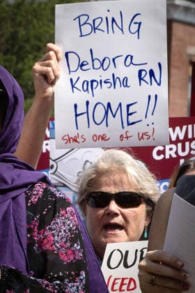 August 5, 2026, Portland, Maine, USA: Members of the Maine State Nurses Association union protest federal Immigration and Customs Enforcement (ICE) on the lawn outside Maine Medical Center, the stateÃ¢â‚¬â ¢s largest hospital, on Wednesday morning, August 5, 2026. Nurses demanded the release of colleague and medical-surgical nurse, DEBORA KAPISHA, who was detained by federal officials at Logan Airport in Boston on July 30, 2026. Union members said KAPISHA, originally from Zambia, has federal authorization to work in Maine while awaiting the outcome of her asylum case. In addition to KAPISHAÃ¢â‚¬â ¢S release, union members demanded their employer, Maine Medical Center, take immediate steps to formally sponsor KAPISHA for permanent residency.  - ZUMAb349 20260805_znp_b349_008 Copyright: xTroyxR.xBennettx