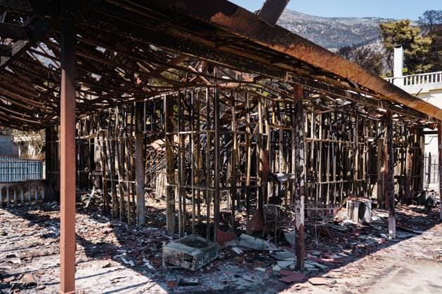 Residents return to wildfire-ravaged homes in western Attica PORTO GERMENO, WEST ATTICA, GREECE AUGUST 5, 2026: Extensive destruction caused by a major wildfire is seen in Porto Germeno, western Attica, four days after the fire swept through the area. More than 50 homes sustained damage ranging from partial destruction to complete collapse. Recovery and assessment operations continue as crews clear debris and inspection teams from Greece s General Secretariat for Natural Disaster Recovery evaluate damaged properties. Parts of the area remain without electricity and running water while restoration efforts continue. Porto Germeno Greece Copyright: x xRomanosxLioutasx xJNAxPressx