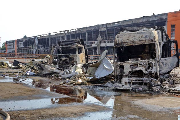 Burnt-out trucks are at a logistics complex destroyed by a Russian missile strike in the village of Chaiky, Kyiv region, Ukraine, August 5, 2026. A direct hit triggered a large-scale fire that destroyed the main warehouse hub. Parking areas and freight vehicles also caught fire. (Photo by Volodymyr Tarasov Ukrinform) Russian missile strike hits logistics complex in Kyiv region  Copyright: xVolodymyrxTarasovx