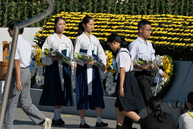 Participants offer flowers during the ceremony for the atomic bomb victims at Hiroshima Peace Memorial Park marking the 81th anniversary of the atomic bombing of Hiroshima, Japan on Thursday, August 6, 2026.  TKP2026080604 KEIZOxMORI