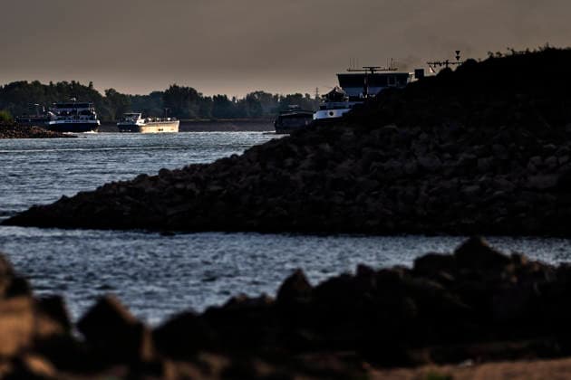 August 6, 2026, Nijmegen, Gelderland, Netherlands: Looking upstream towards GERMANY near NIJMEGEN, the cargo barge JUPITER LUXEMBOURG sails along the WAAL past the exposed sandy riverbed that has emerged due to critically low water levels. This main Dutch branch of the RHINE is experiencing historic lows caused by prolonged drought, forcing inland vessels to operate with sharply reduced loads. Credit : ZUMA Press Nijmegen Netherlands - ZUMAv145 20260806_zip_v145_006 Copyright: xNorbertxVoskensx