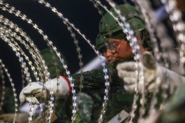 Han Kuang Military Exercise in Taiwan NEW TAIPEI, TAIWAN - AUGUST 6: Taiwanese soldiers set up barbed wires on the Danjiang (Tamkang) Bridge to simulate stopping Chinese forces from approaching, during an obstacle emplacement operation as part of the Han-Kuang military exercise, in New Taipei City, Taiwan on August 6, 2026. The 10-days long Han-Kuang exercise with unscripted training sessions test the island s defense capabilities in the event of a possible invasion by China, as Beijing has significantly increased its military activities around the Taiwan Strait and the South China Sea. Daniel Ceng Anadolu New Taipei Taiwan. Editorial use only. Please get in touch for any other usage.  Copyright: x2026xAnadoluxDanielxCengx