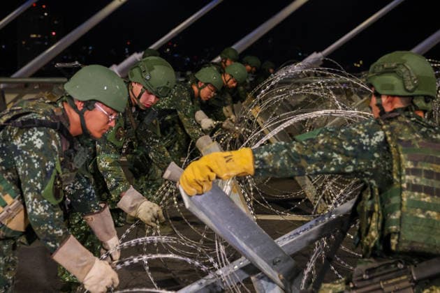 Han Kuang Military Exercise in Taiwan NEW TAIPEI, TAIWAN - AUGUST 6: Taiwanese soldiers set up anti-tank obstacles on the Danjiang (Tamkang) Bridge to simulate stopping Chinese forces from approaching, during an obstacle emplacement operation as part of the Han-Kuang military exercise, in New Taipei City, Taiwan on August 6, 2026. The 10-days long Han-Kuang exercise with unscripted training sessions test the island s defense capabilities in the event of a possible invasion by China, as Beijing has significantly increased its military activities around the Taiwan Strait and the South China Sea. Daniel Ceng Anadolu New Taipei Taiwan. Editorial use only. Please get in touch for any other usage.  Copyright: x2026xAnadoluxDanielxCengx