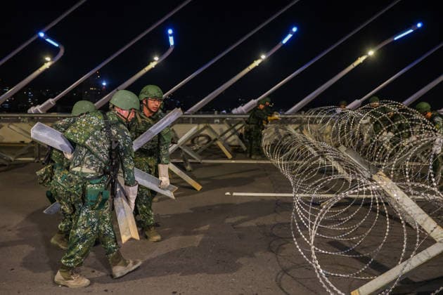 Han Kuang Military Exercise in Taiwan NEW TAIPEI, TAIWAN - AUGUST 6: Taiwanese soldiers set up anti-tank obstacles on the Danjiang (Tamkang) Bridge to simulate stopping Chinese forces from approaching, during an obstacle emplacement operation as part of the Han-Kuang military exercise, in New Taipei City, Taiwan on August 6, 2026. The 10-days long Han-Kuang exercise with unscripted training sessions test the island s defense capabilities in the event of a possible invasion by China, as Beijing has significantly increased its military activities around the Taiwan Strait and the South China Sea. Daniel Ceng Anadolu New Taipei Taiwan. Editorial use only. Please get in touch for any other usage.  Copyright: x2026xAnadoluxDanielxCengx