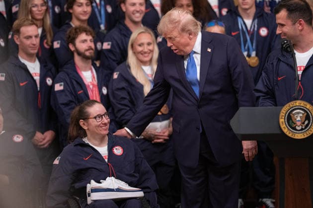 President Trump Hosts Team USA Olympians at White House Paralympic Team USA athlete Laurie Stephens is greeted by United States President Donald J Trump in the East Room of the White House in Washington, DC, USA, on Thursday, August 6, 2026. President Trump is hosting a ceremony for Team USA Olympians who competed in the 2026 Olympic Winter Games in Italy. Credit: Aaron Schwartz Pool via CNP Washington District of Columbia United States  Copyright: xPool ABACAx