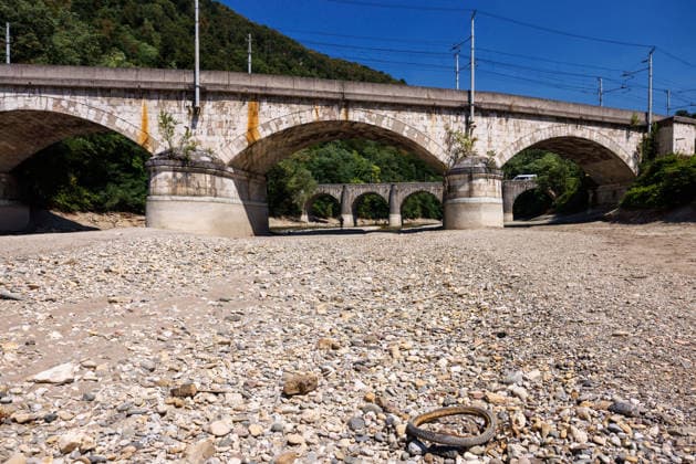 August 6, 2026, Zidani Most, Slovenia: A mostly dry riverbed of Savinja river near its confluence with Sava river is seen in Zidani Most. Slovenia faces record low water levels due to longlasting drought and a recent heatwave, causing the KrÅ¡ko Nuclear Power Plant to reduce power and a temporary suspension of fishing on several rivers. Zidani Most Slovenia - ZUMAs197 20260806_aaa_s197_204 Copyright: xLukaxDakskoblerx