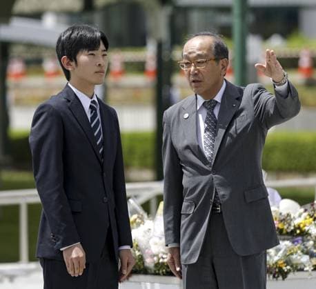 Japan Prince Hisahito visits Hiroshima Japanese Prince Hisahito (L), Emperor Naruhito s nephew, gets a briefing from Hiroshima Mayor Kazumi Matsui after laying flowers at the cenotaph in the Peace Memorial Park in Hiroshima on Aug. 7, 2026, a day after the 81st anniversary of the U.S. atomic bombing of the western Japan city.  A14AA0005625312P